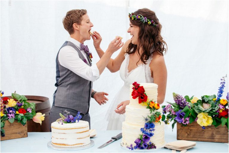 Brides eating wedding cake