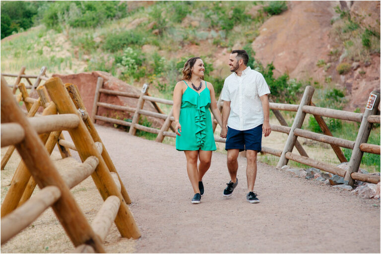 Couple walks holding hands on nature trail