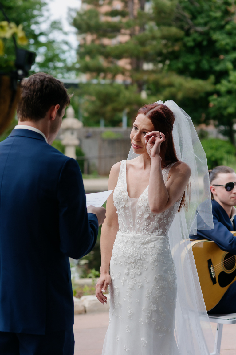 Denver Botanic Gardens microwedding ceremony in the gazebo, photo of bride tearing up