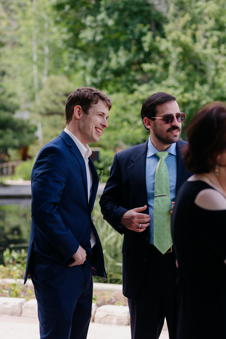 Photo of groom laughing at Denver Botanic Gardens microwedding