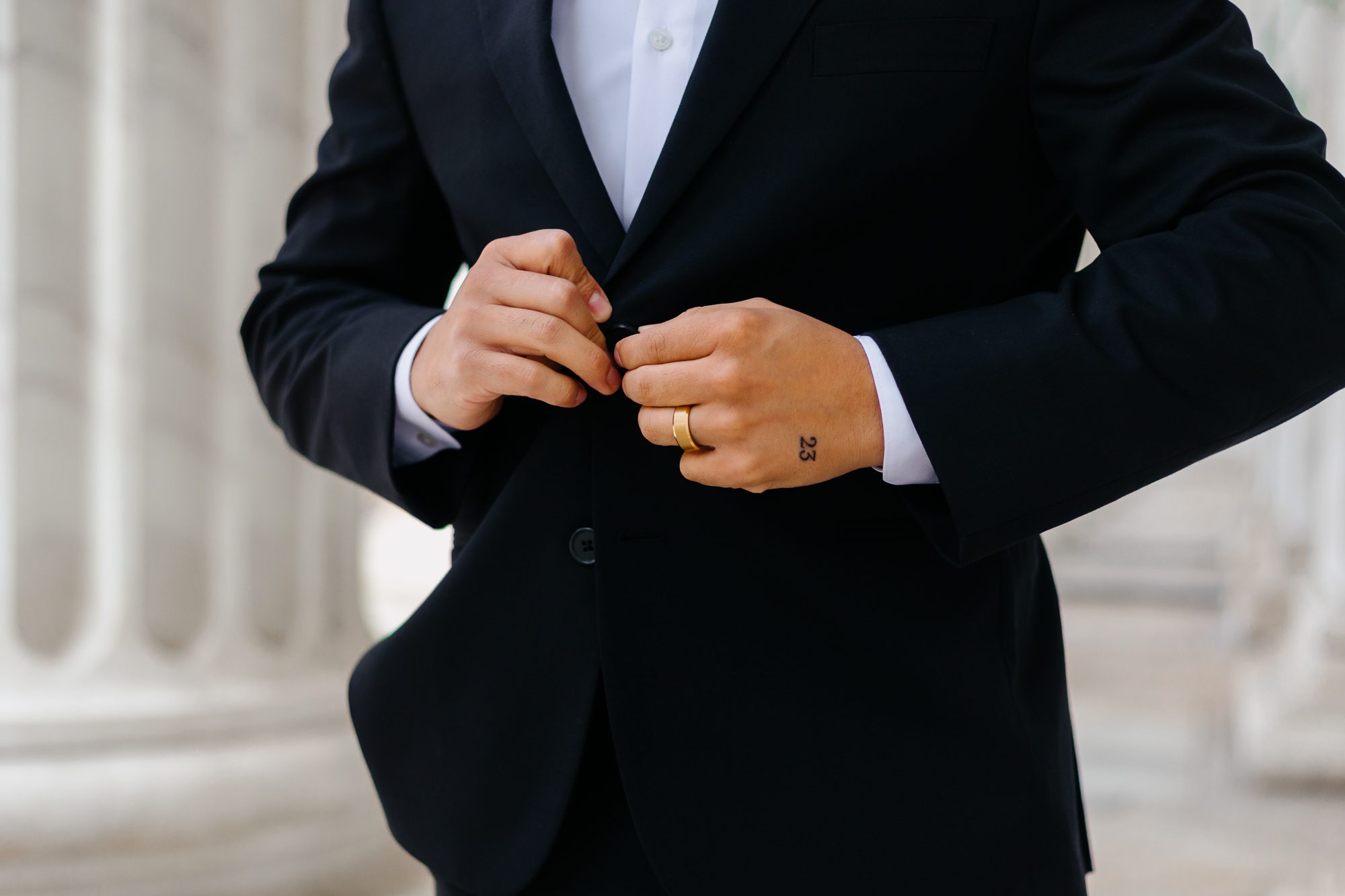 Close-up of matching hand tattoos commemorating their elopement