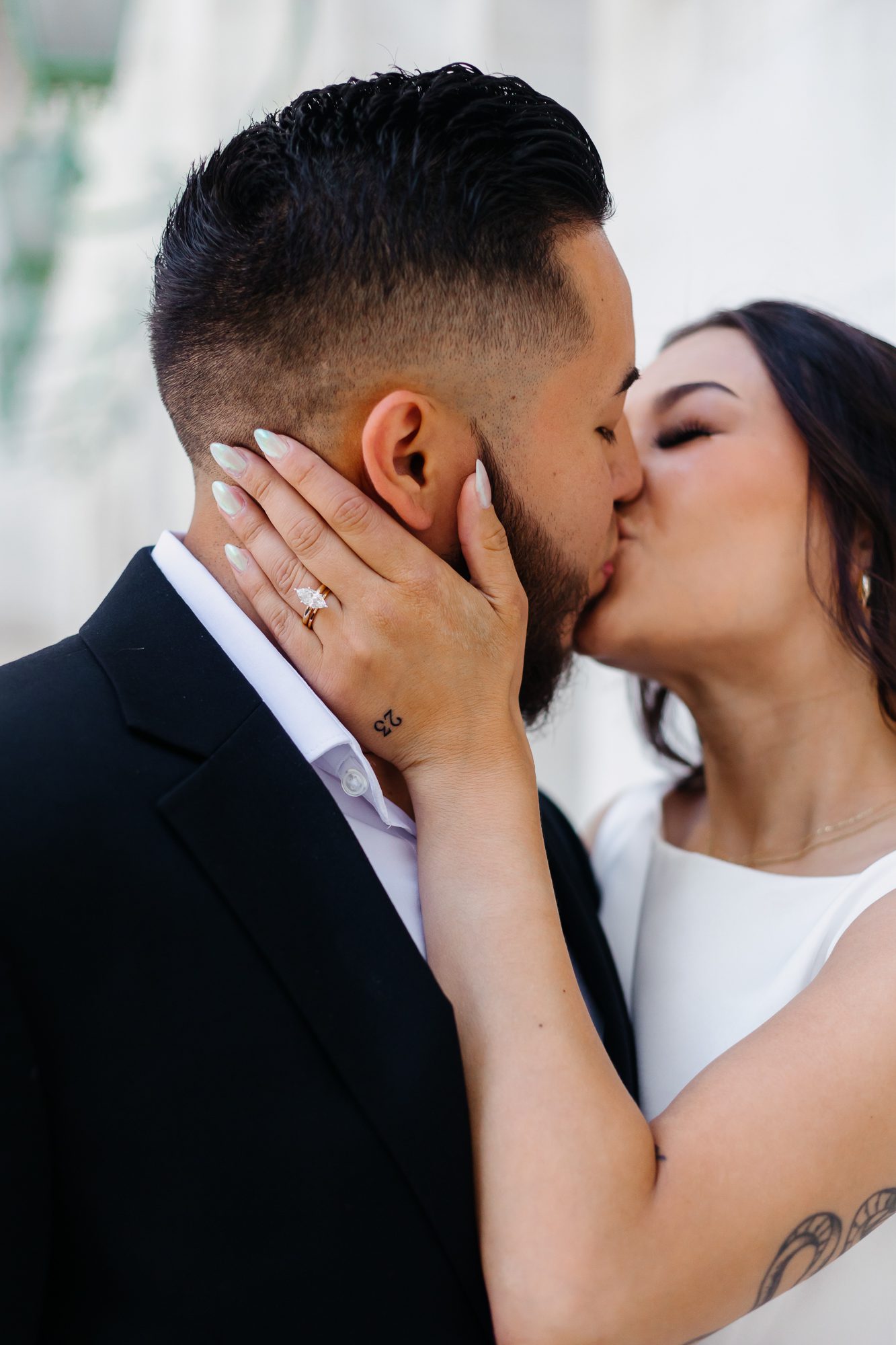 Close-up of matching hand tattoos commemorating their elopement