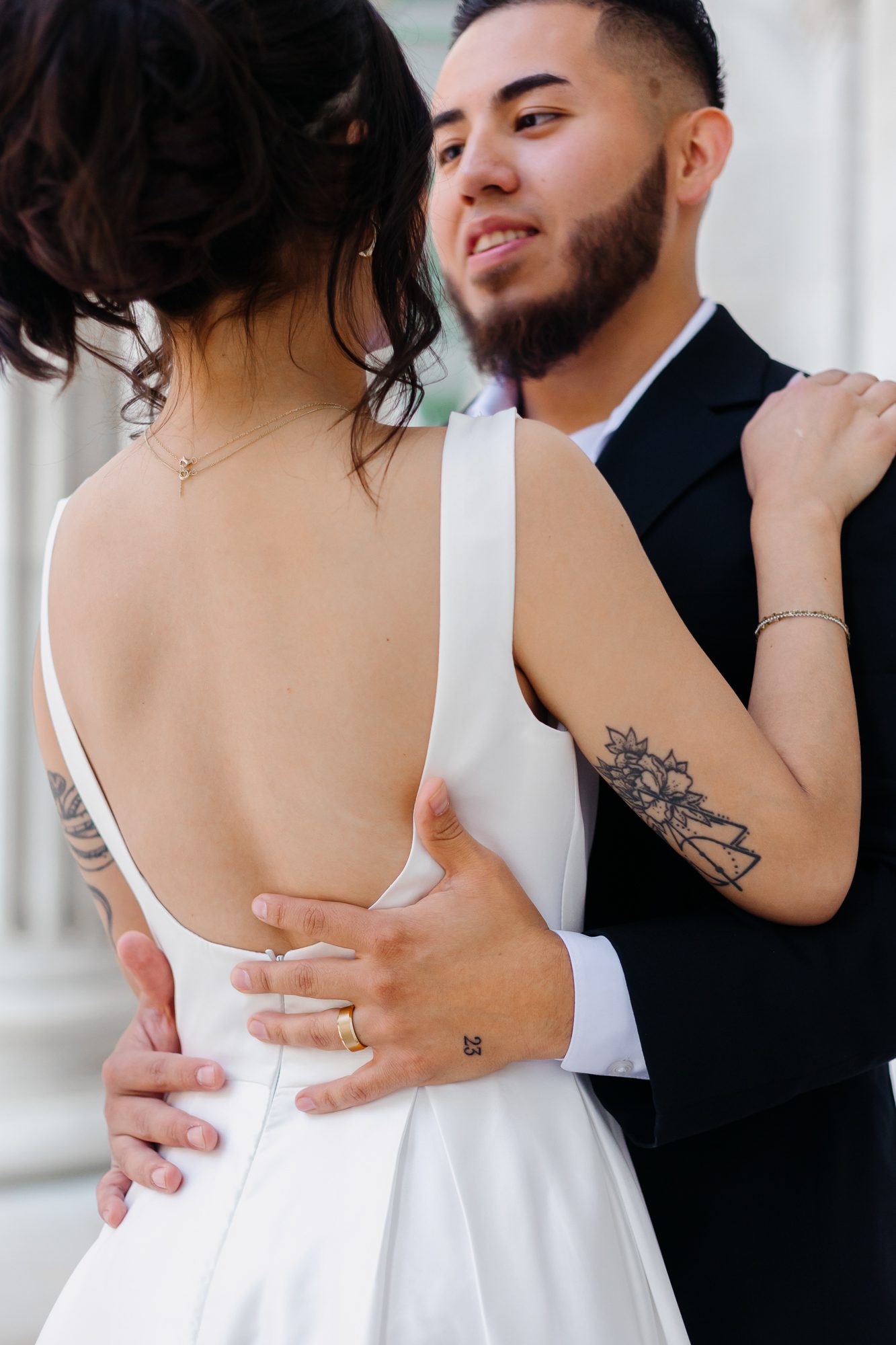 Close-up of matching hand tattoos commemorating their elopement