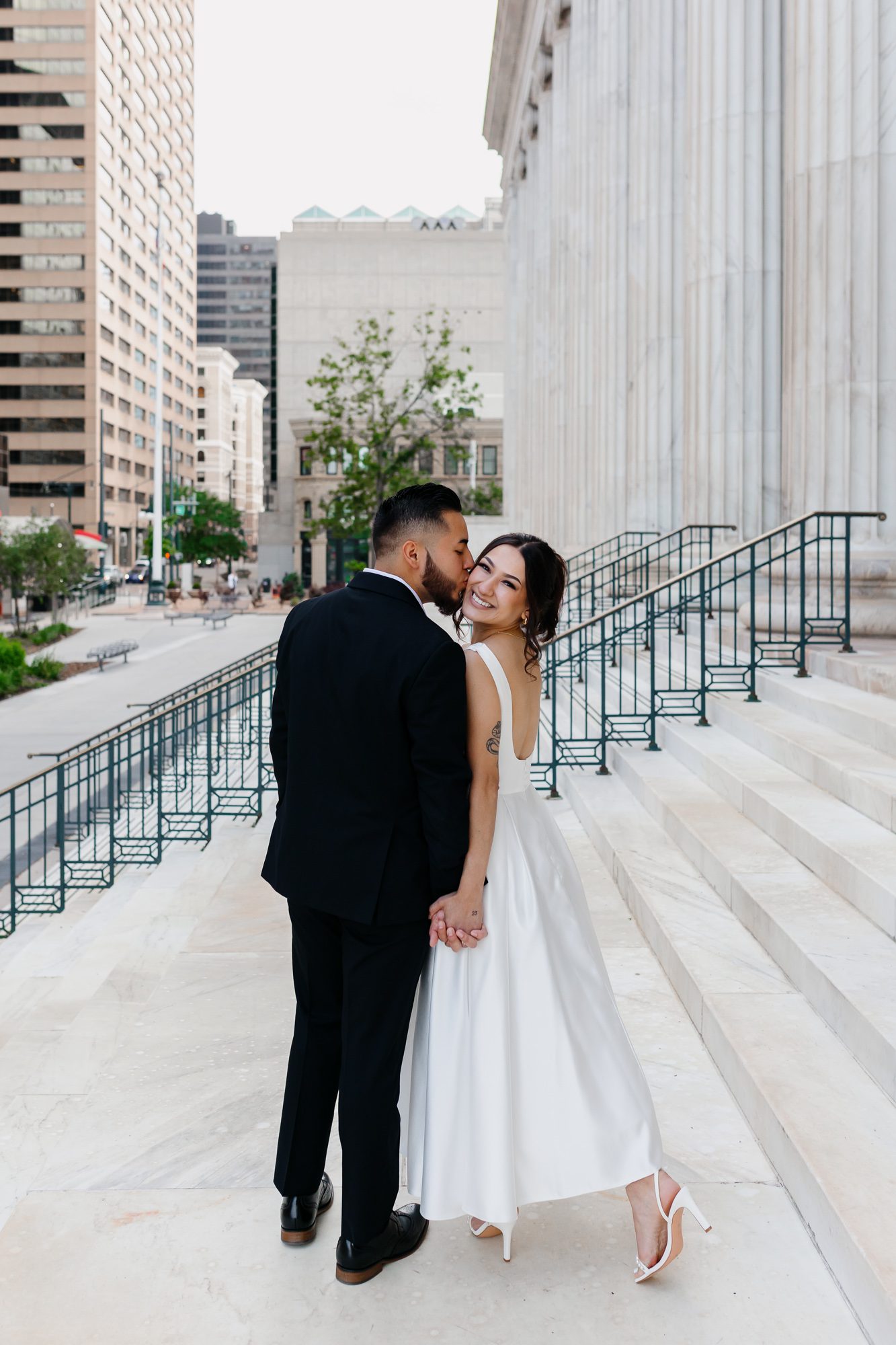 Couple walking hand in hand after Denver courthouse elopement