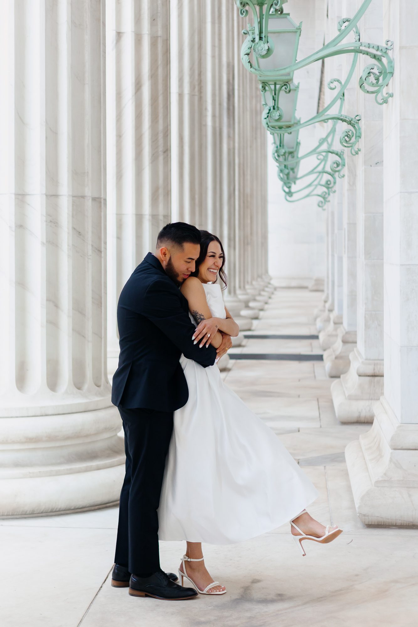 Bride and groom celebrating their courthouse elopement in Denver