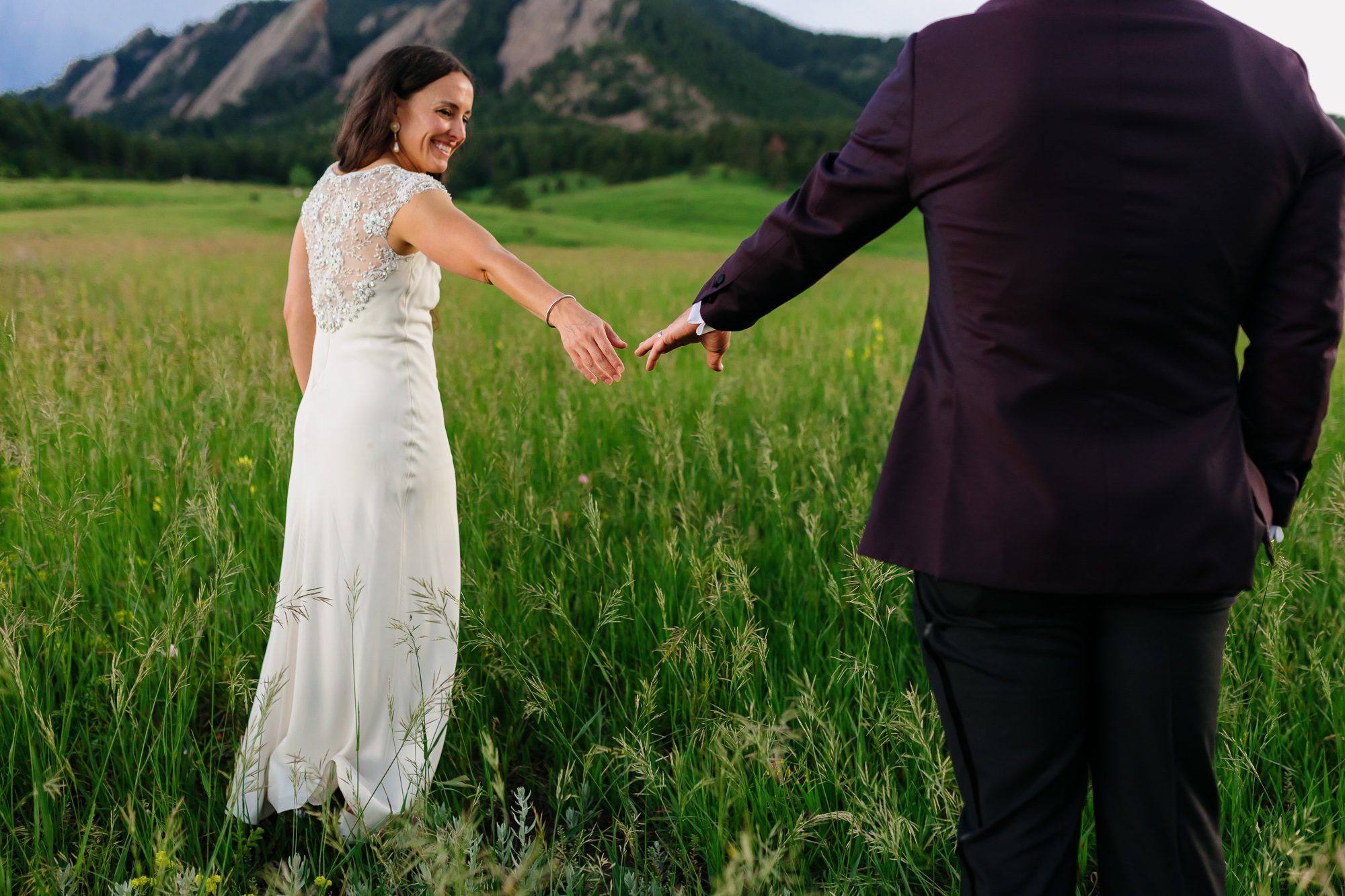 Couple posing for Boulder elopement photos during their anniversary session