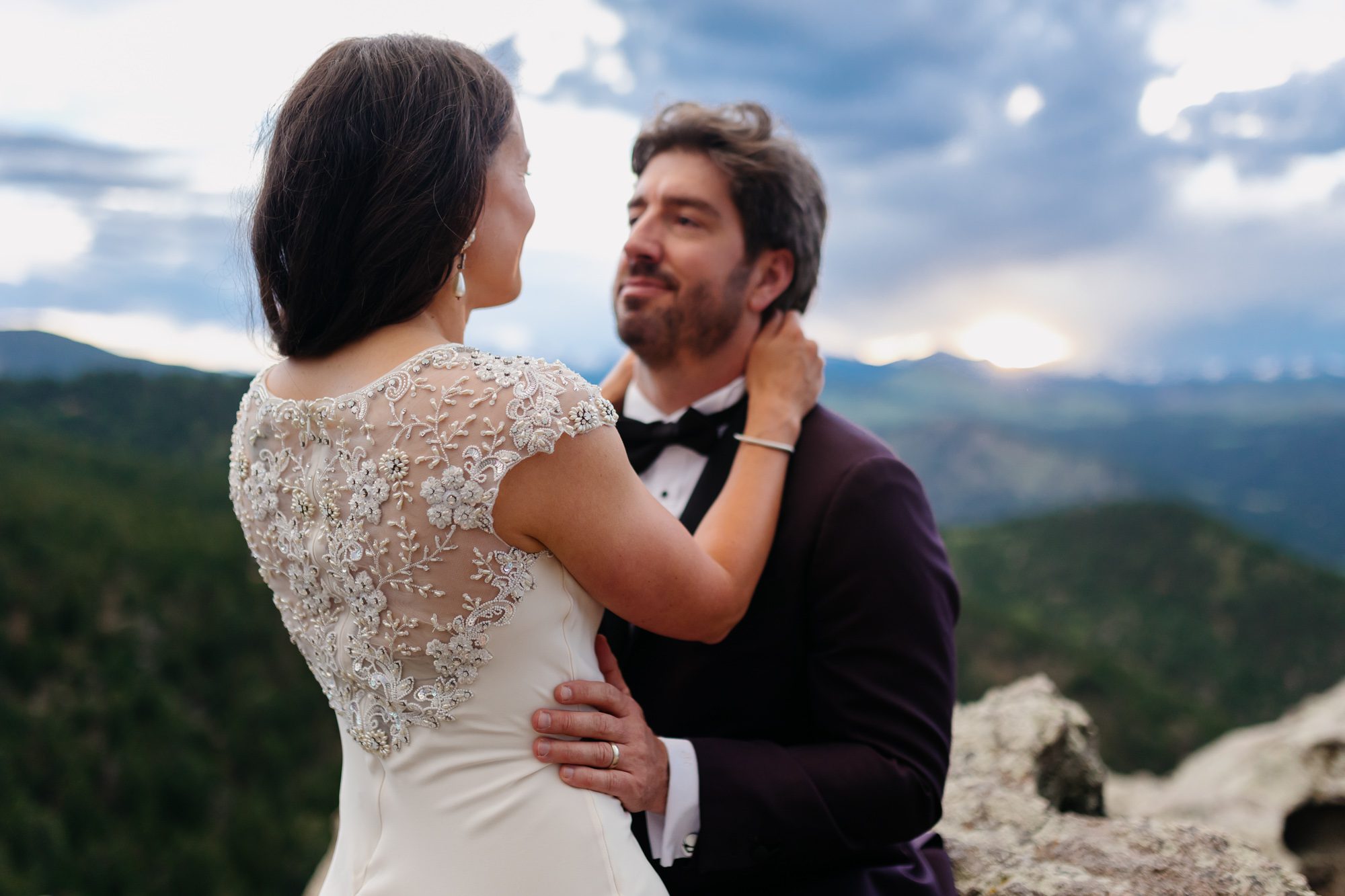Couple posing for Boulder elopement photos during their anniversary session
