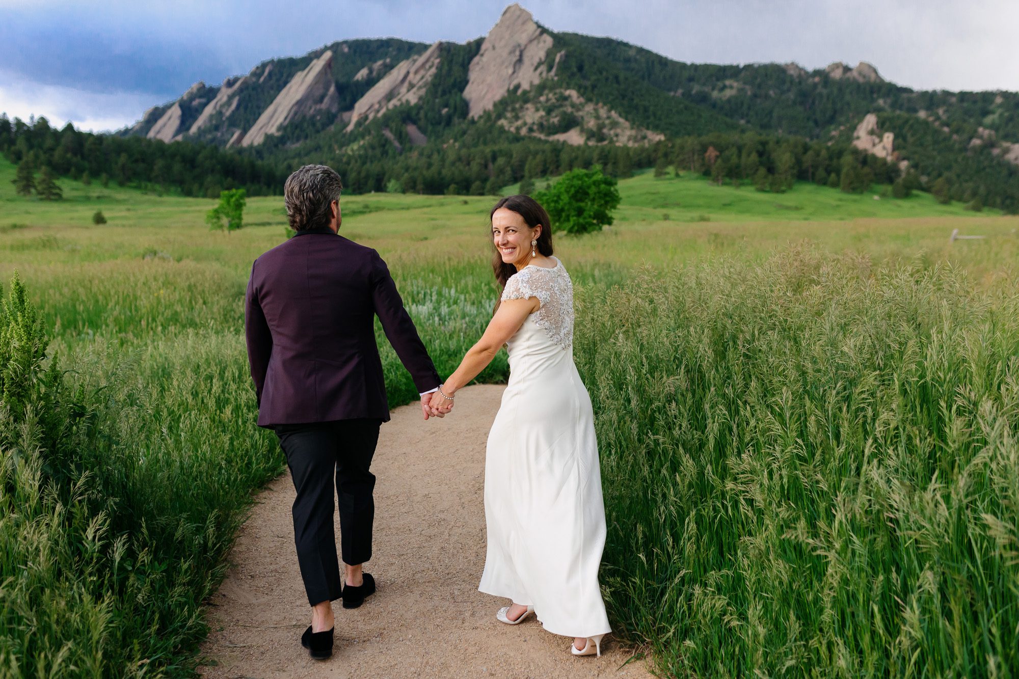 Couple posing for Boulder elopement photos during their anniversary session