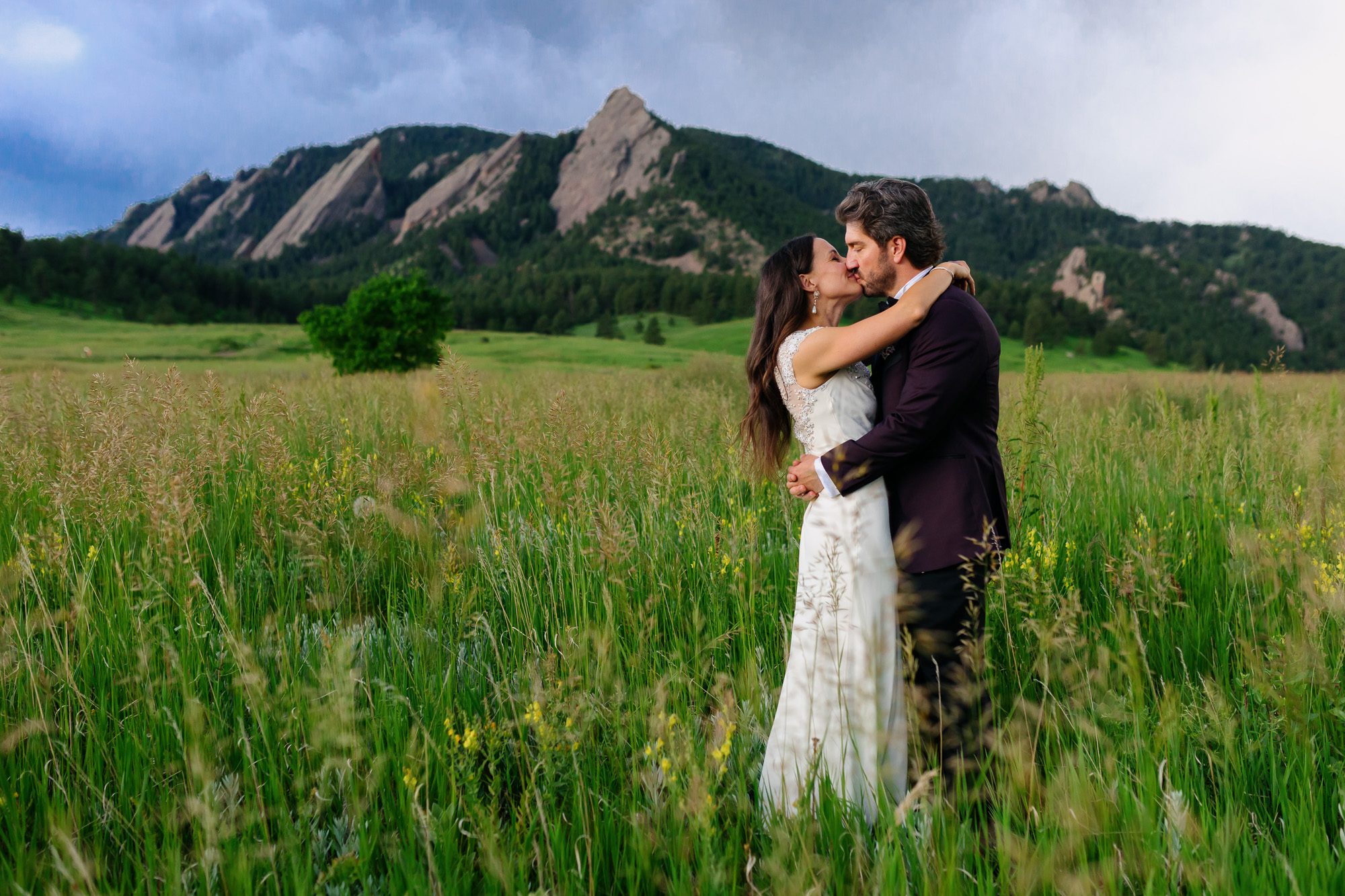 Couple posing for Boulder elopement photos during their anniversary session