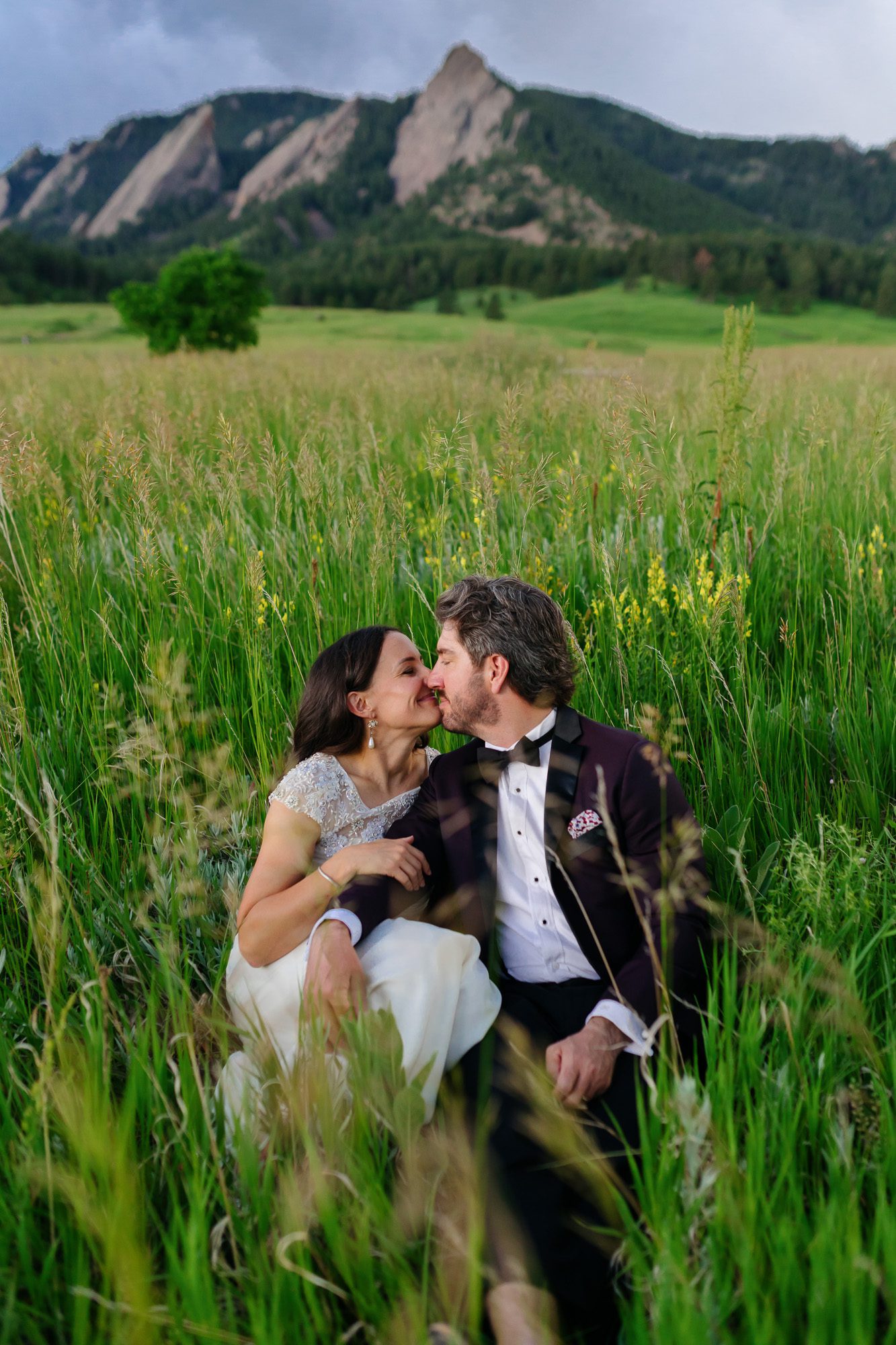 Couple posing for Boulder elopement photos during their anniversary session