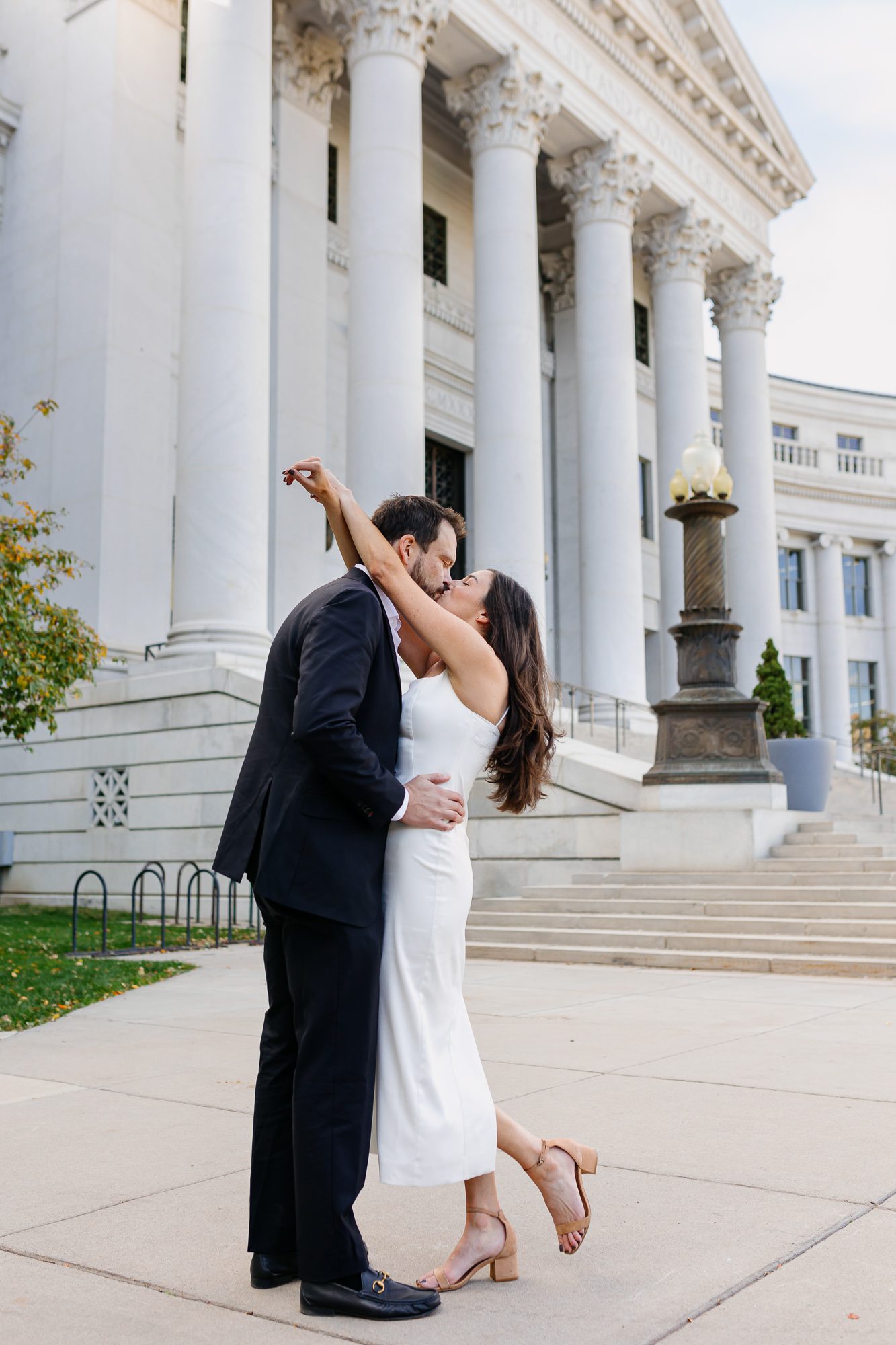Denver courthouse elopement photographer captures bride and groom in Civic Center Park