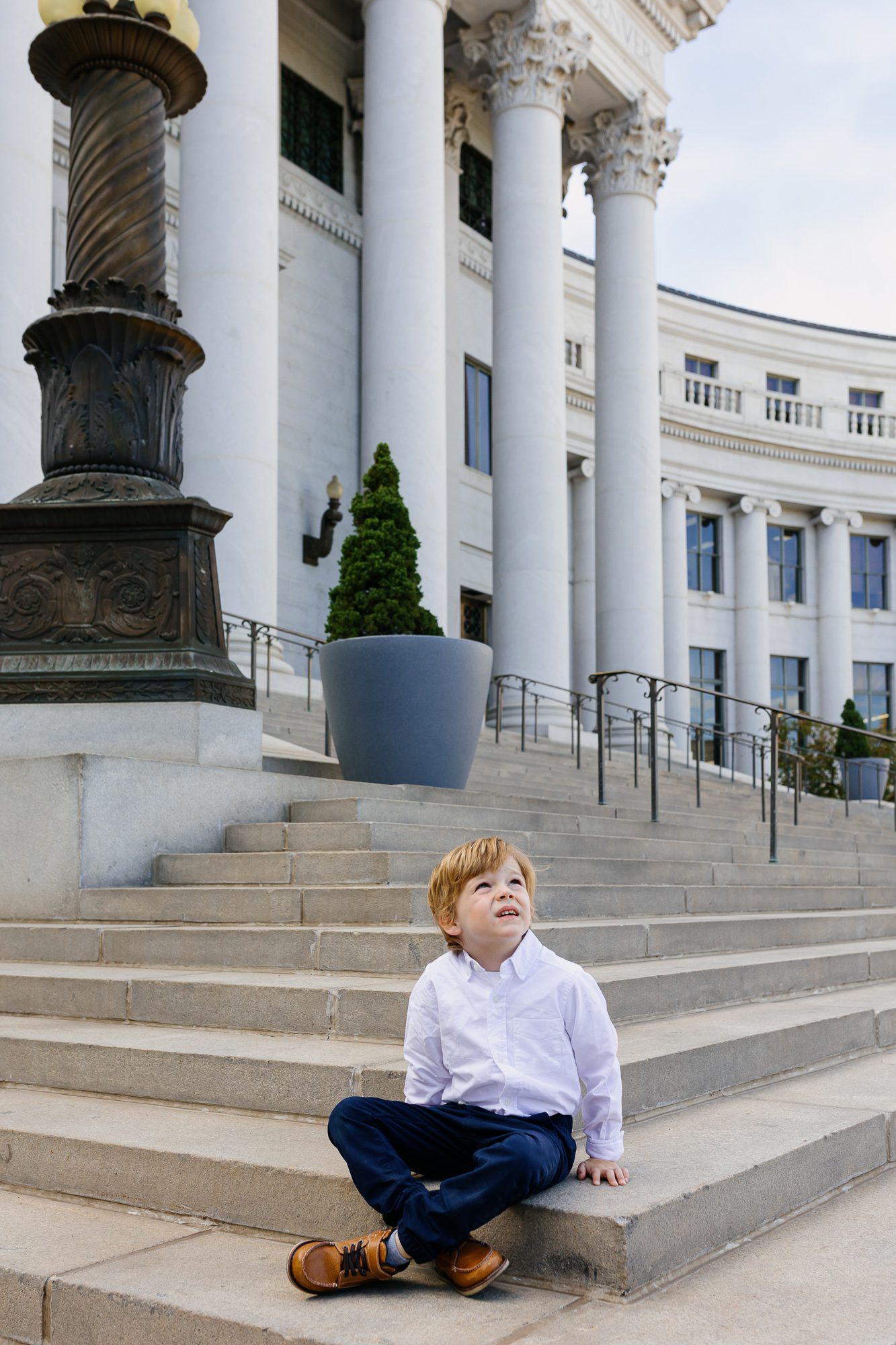 Denver courthouse elopement photographer captures ring bearer on courthouse steps