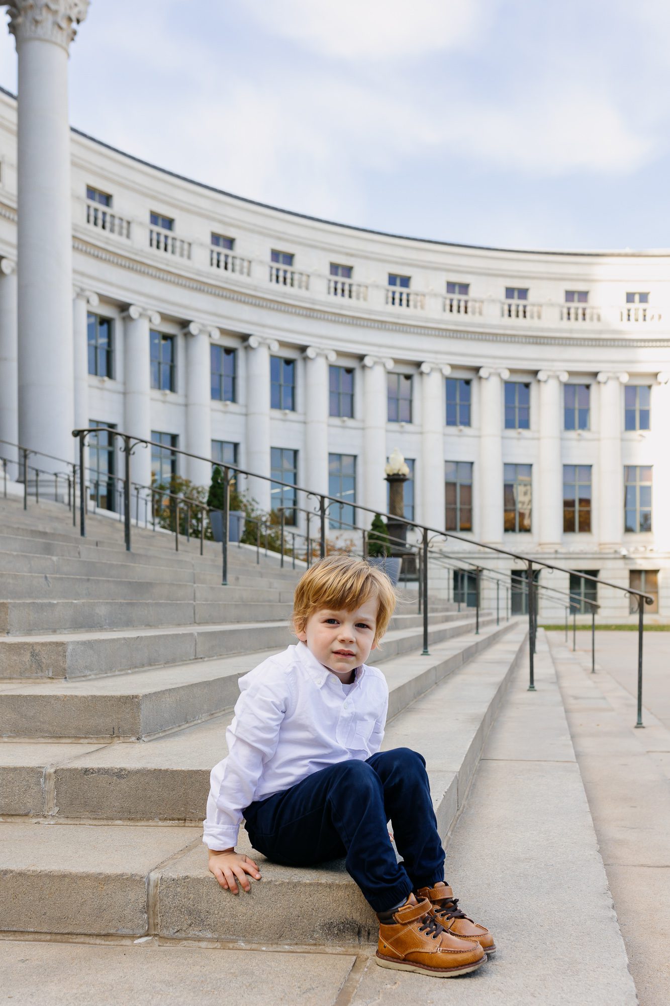 Denver courthouse elopement photographer captures ring bearer on courthouse steps