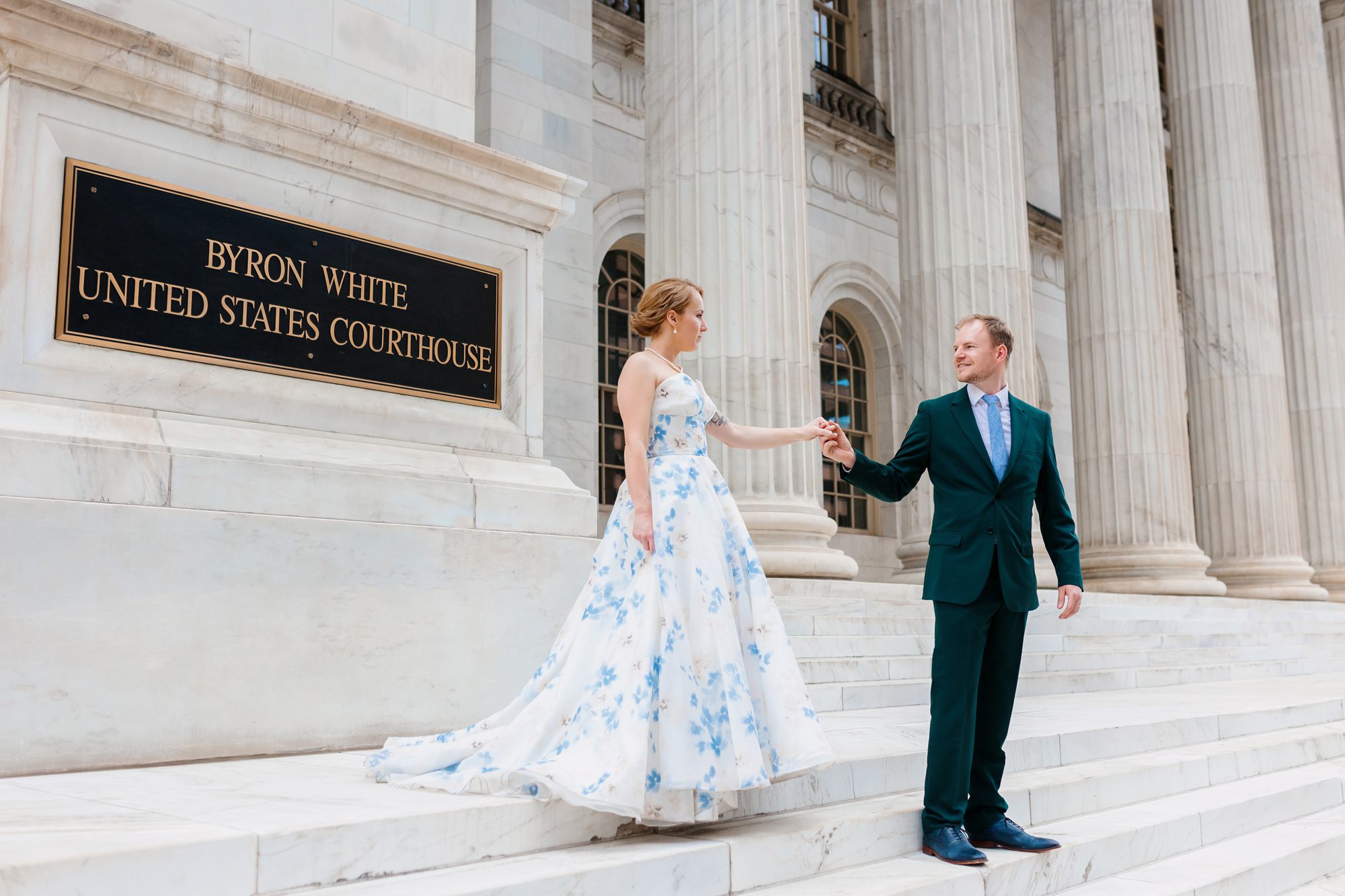 Clients posing for Denver courthouse elopement photos