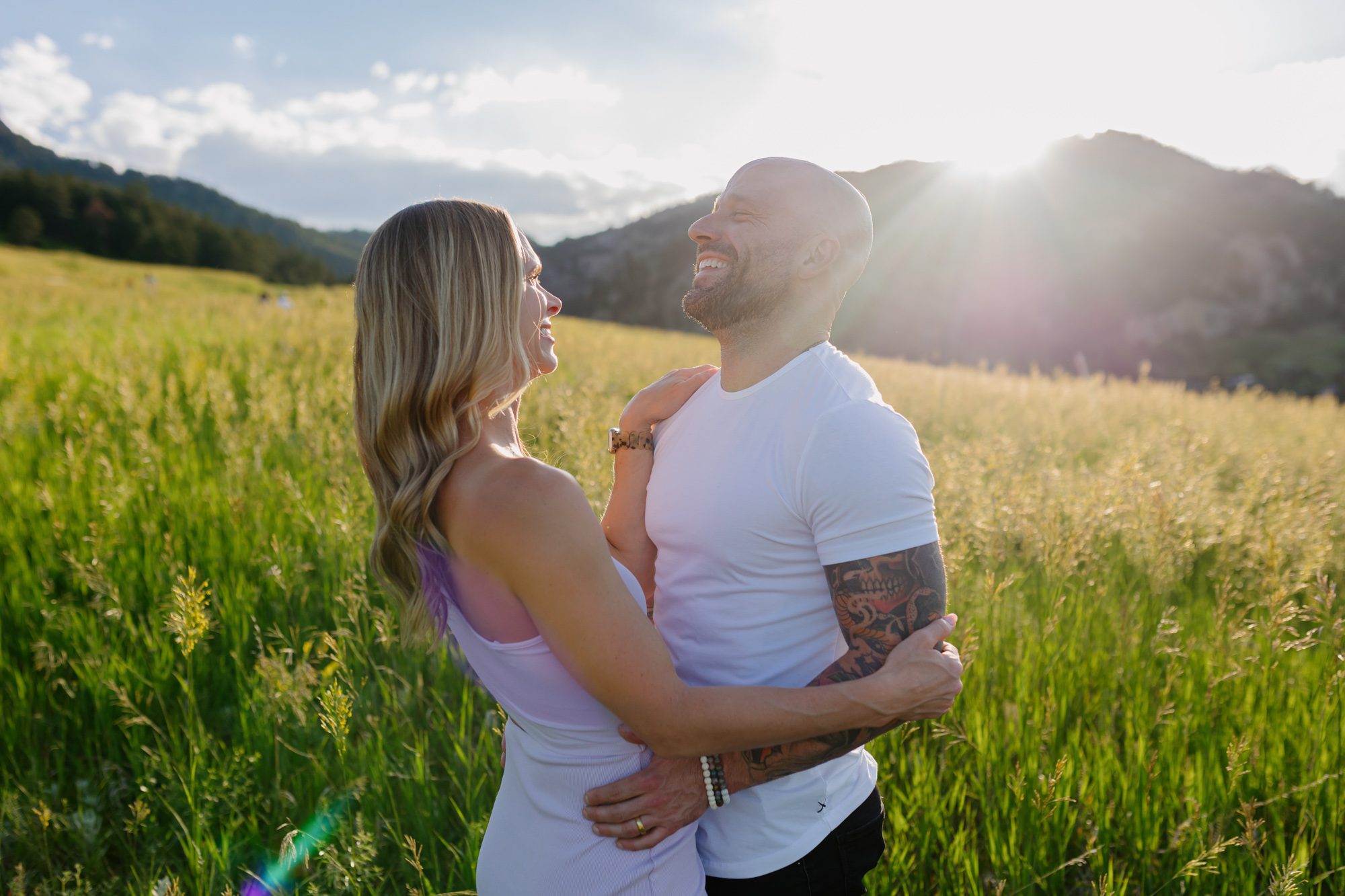 Couple posing for photos at Chautauqua Park in Boulder