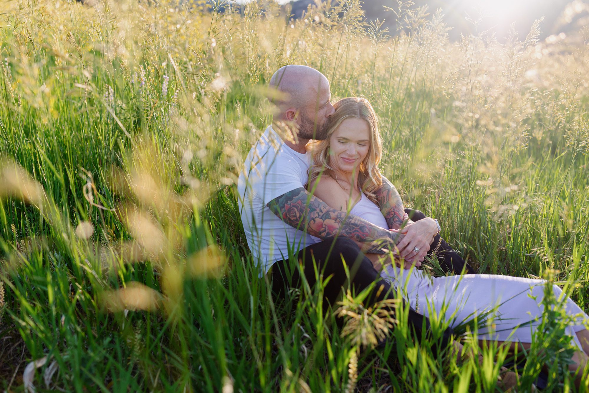 Couple posing for photos at Chautauqua Park in Boulder