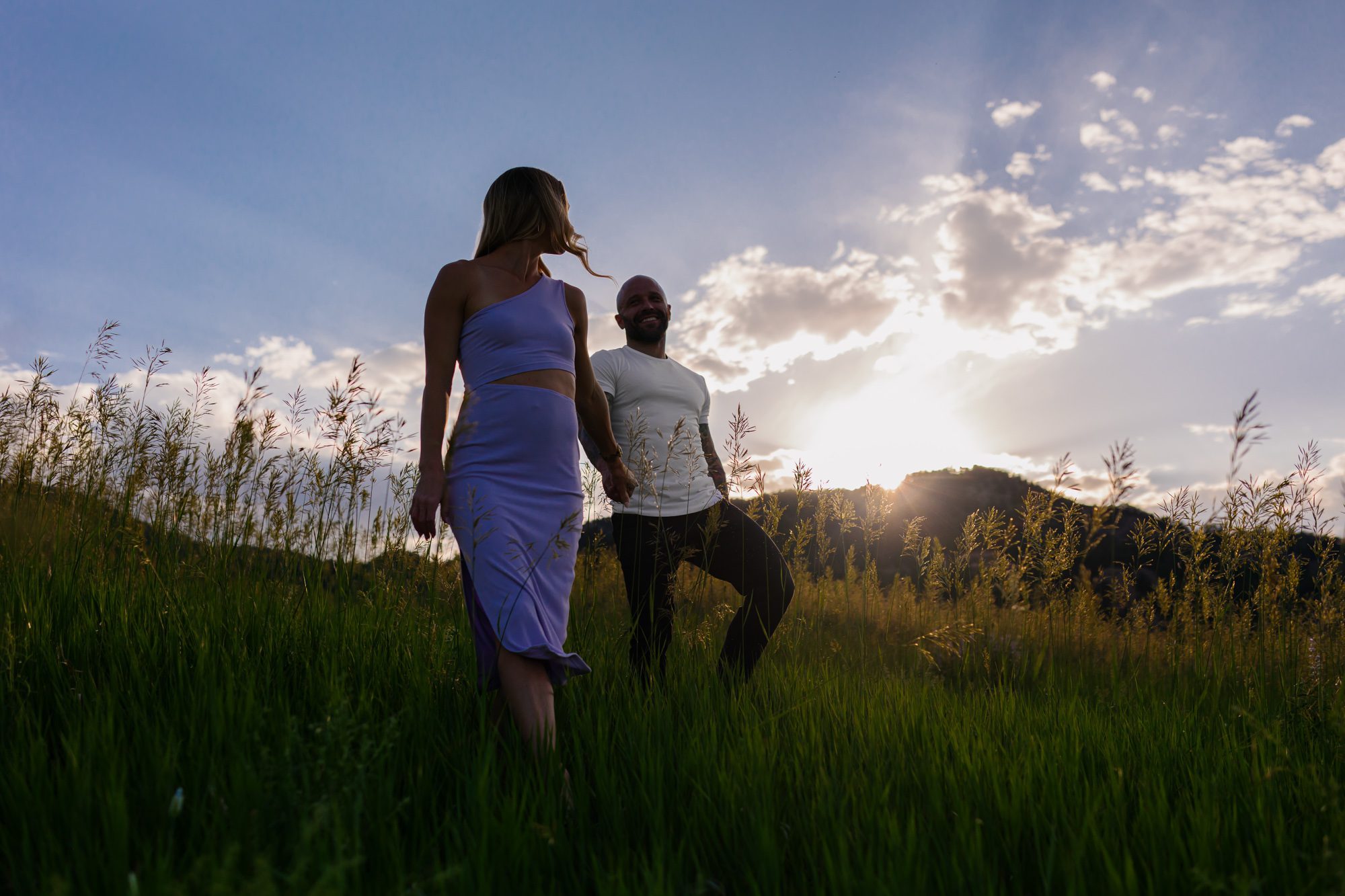 Couple posing for photos at Chautauqua Park in Boulder