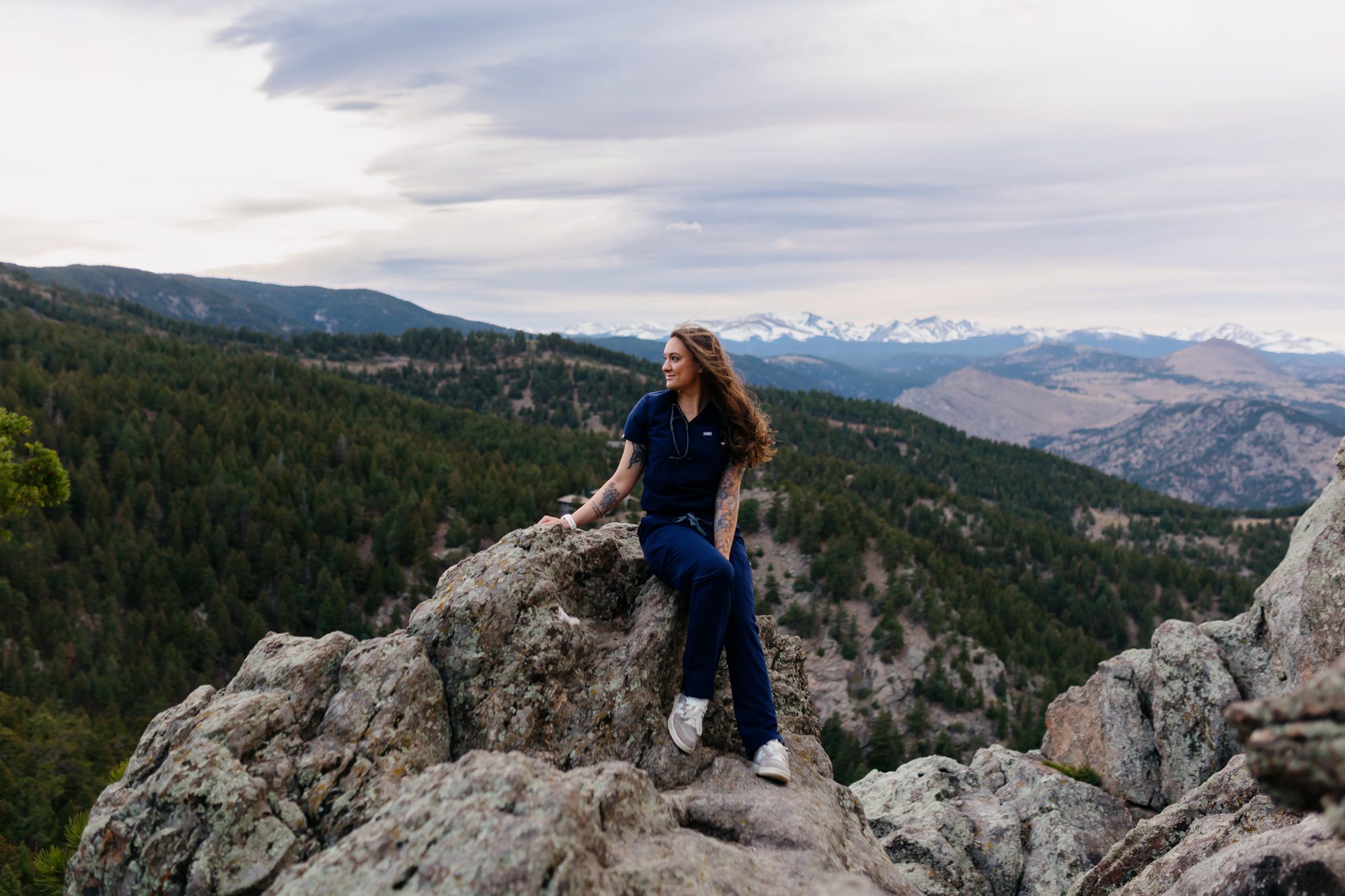 Recent Front Range Community College grad posing for Boulder graduation session at Lost Gulch