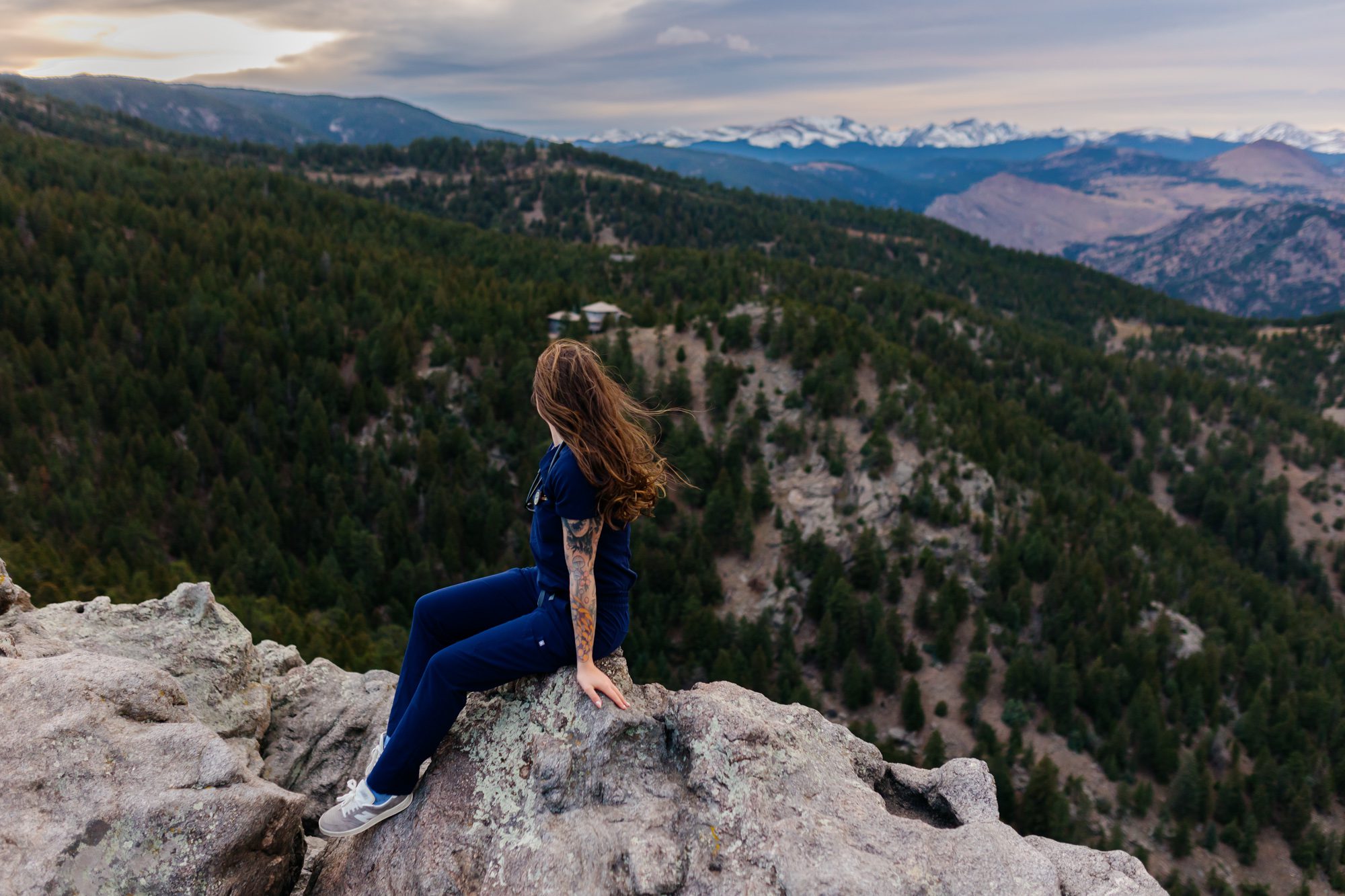 Recent Front Range Community College grad posing for Boulder graduation session at Lost Gulch Overlook