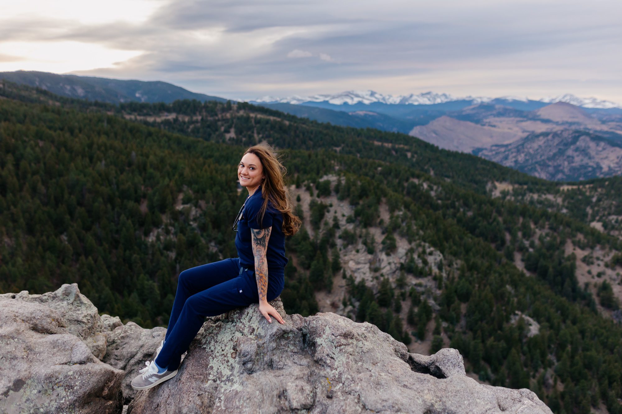 Recent Front Range Community College grad posing for Boulder graduation session at Lost Gulch Overlook