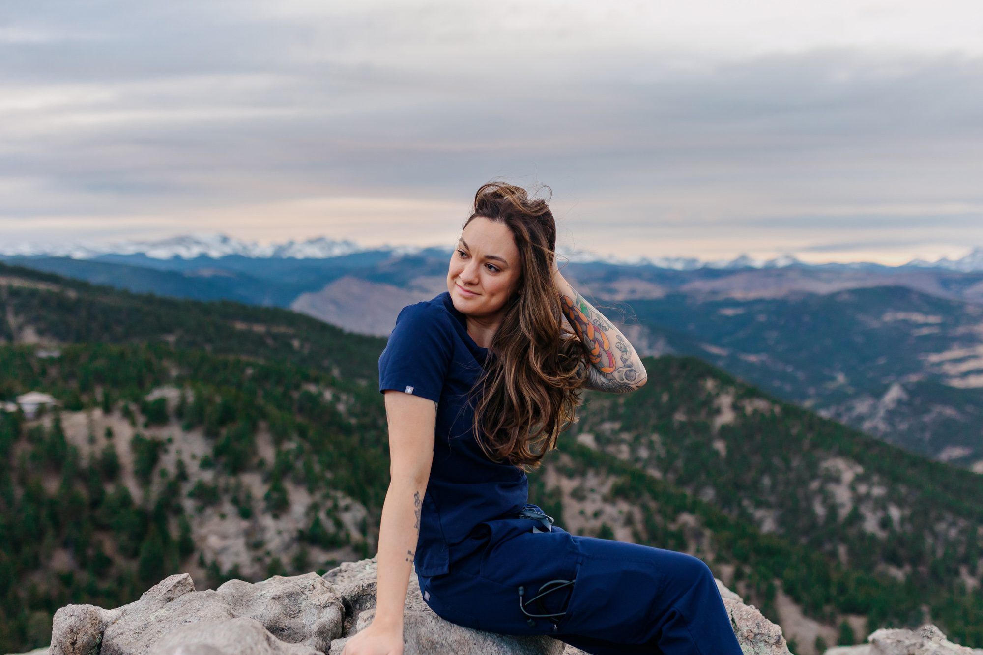 Recent Front Range Community College grad posing for Boulder graduation session at Lost Gulch Overlook