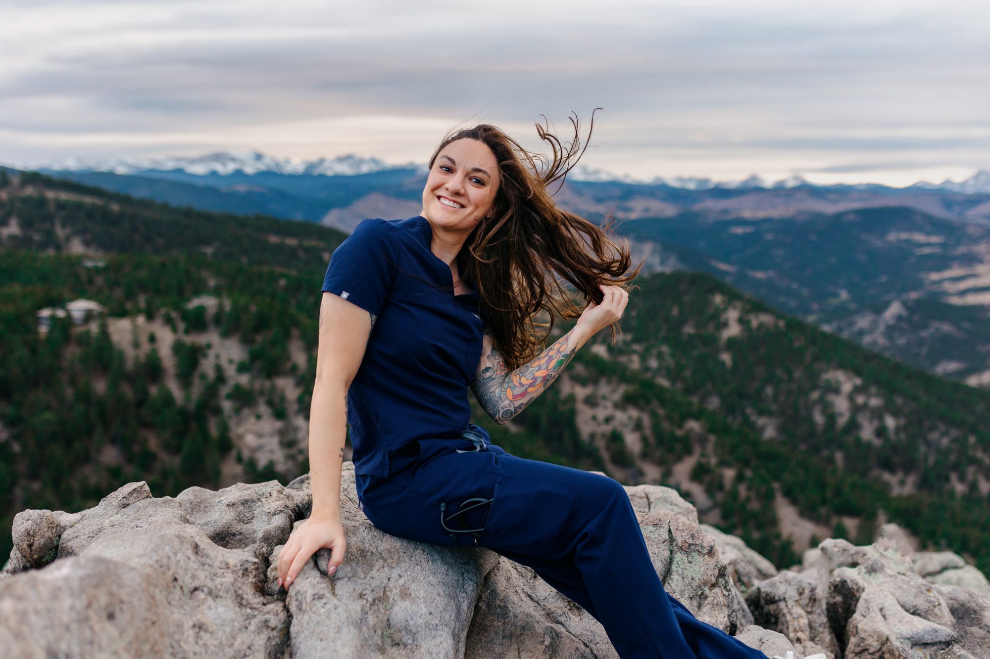 Recent Front Range Community College grad posing for Boulder graduation session at Lost Gulch Overlook
