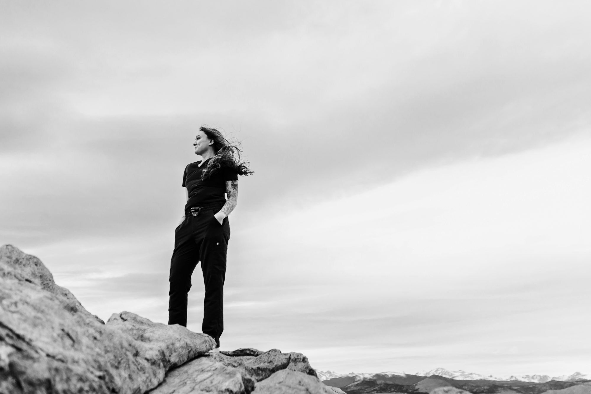 Recent Front Range Community College grad posing for Boulder graduation session at Lost Gulch Overlook 