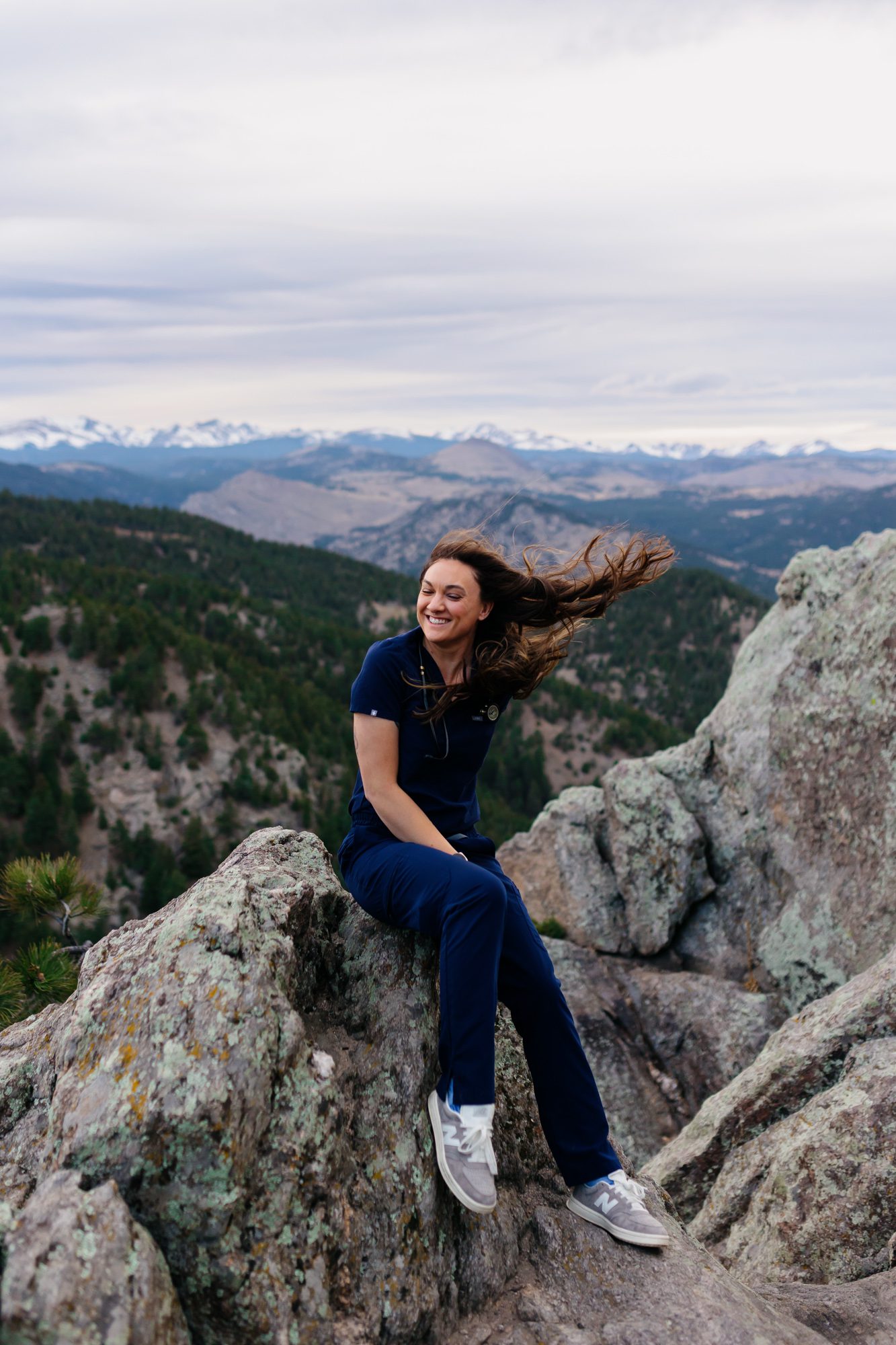 Recent Front Range Community College grad posing for Boulder graduation session at Lost Gulch